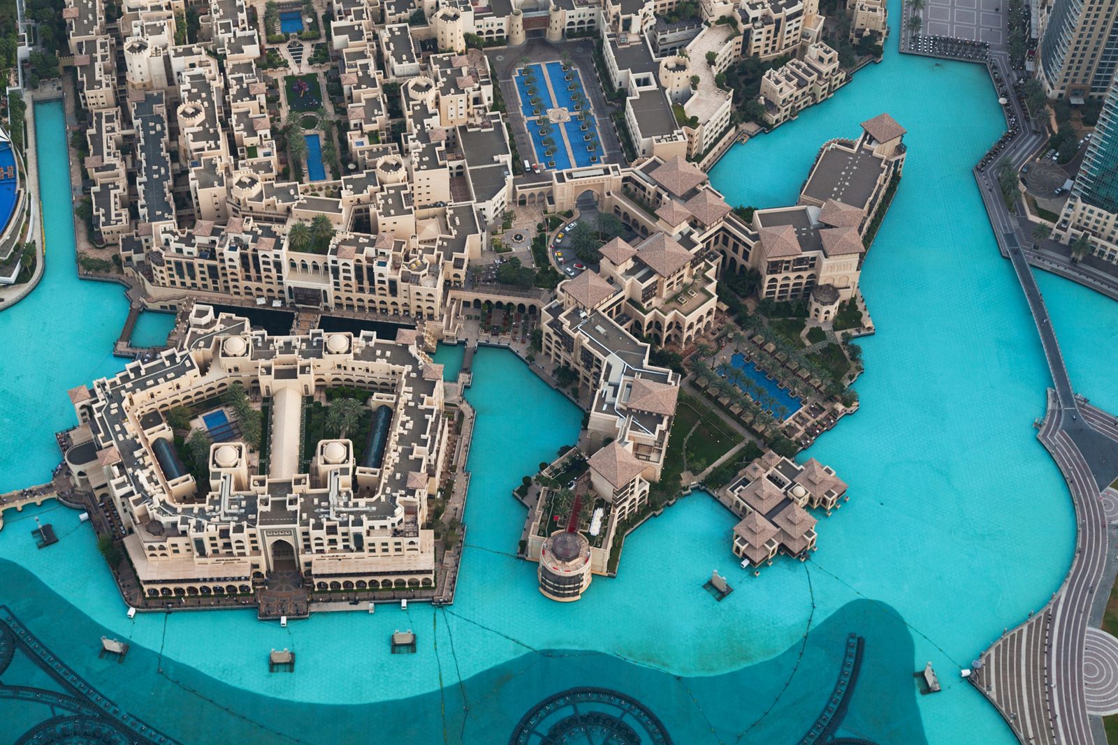 Aerial view of a waterfront resort with turquoise pools, palm-lined paths and sandy beaches, the kind of property behind travel agent incentives